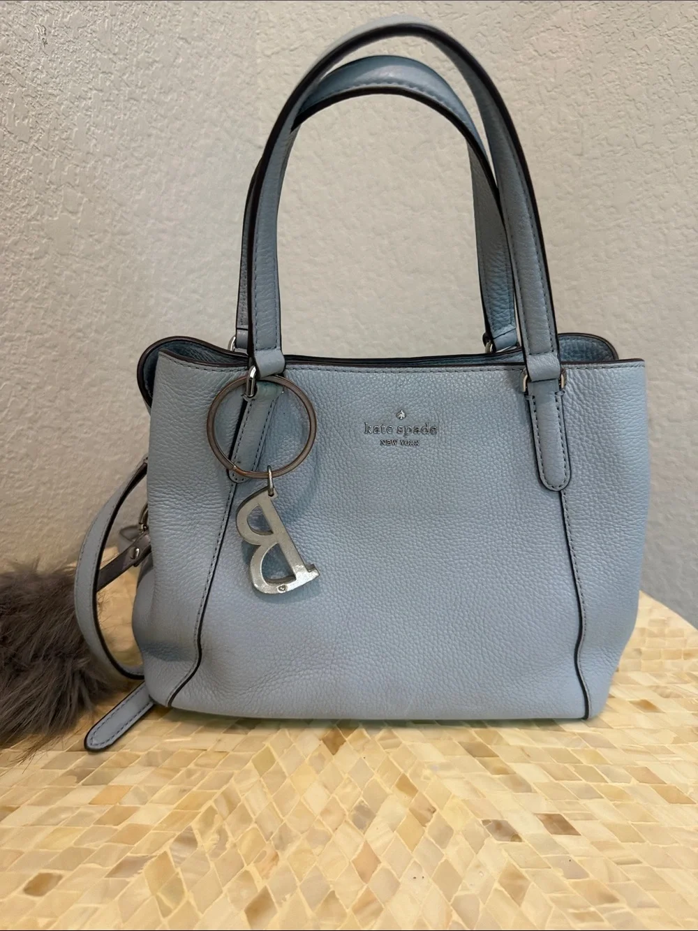 Kate Spade pale blue pebbled leather satchel with charm